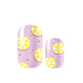 Nail wraps that are light pink and have a yellow lemon slice and dark pink polka dot pattern