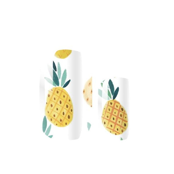 Two white nail wraps with pineapple designs on a white background
