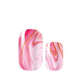 Marbled pink and orange nail art design on a white background